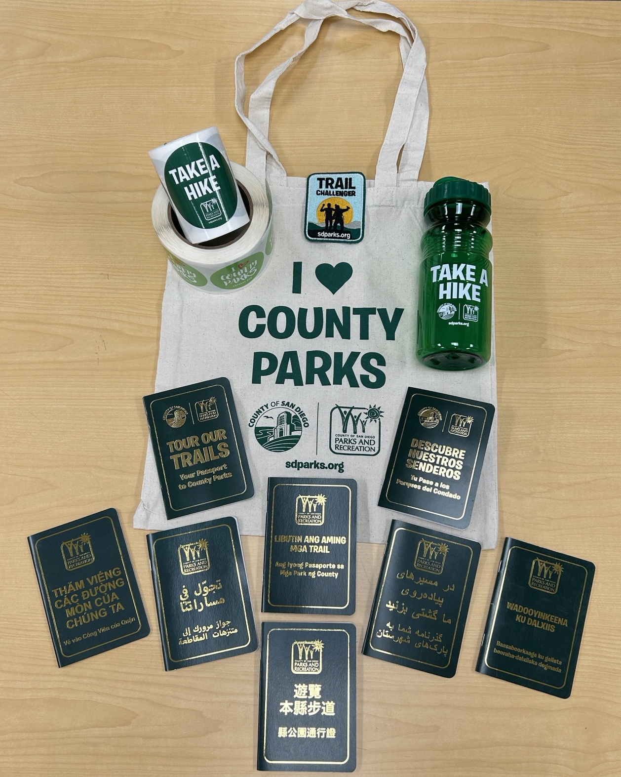 Tour Our Trails Prizes - sticker, bottle, bag, patch