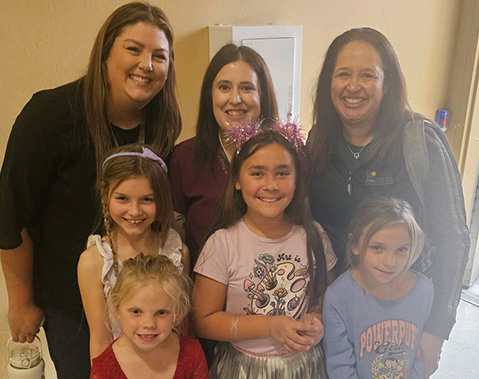 Young girls pose with Women in Rec panelists