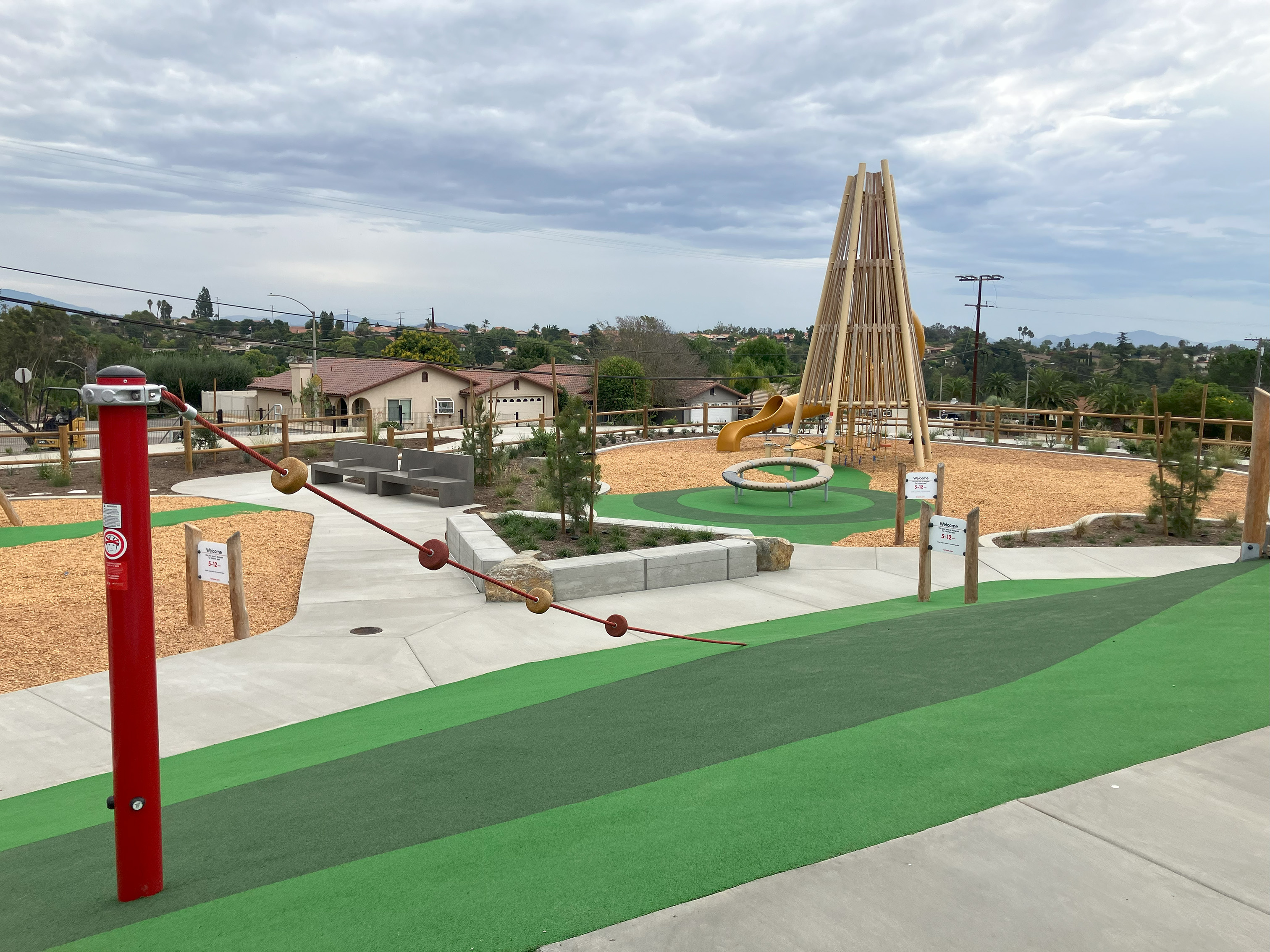 Village View Adventure Play Area showing wooden tower slide