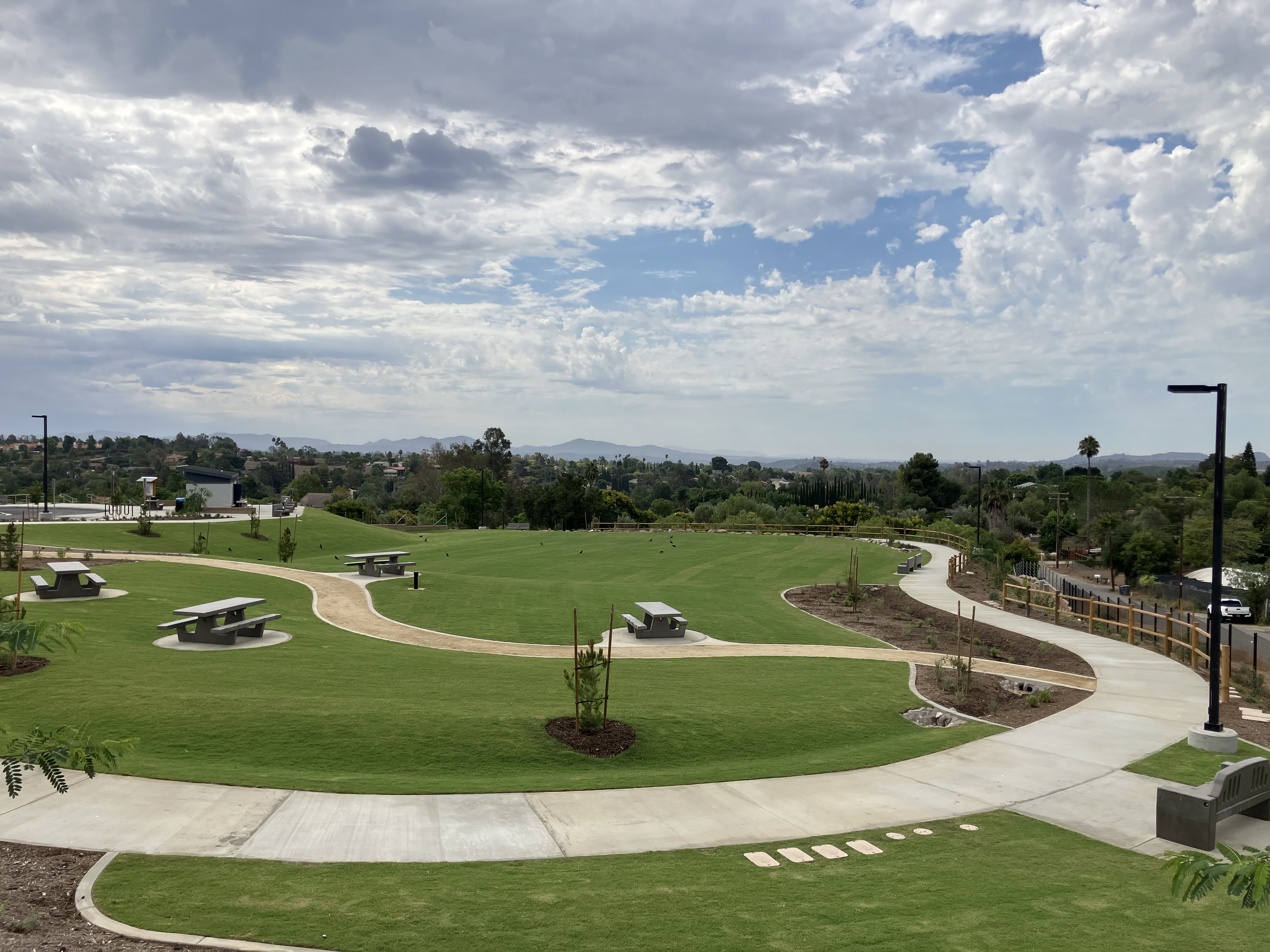 Village View Park Picnic Area showing picnic tables green grass and vast views