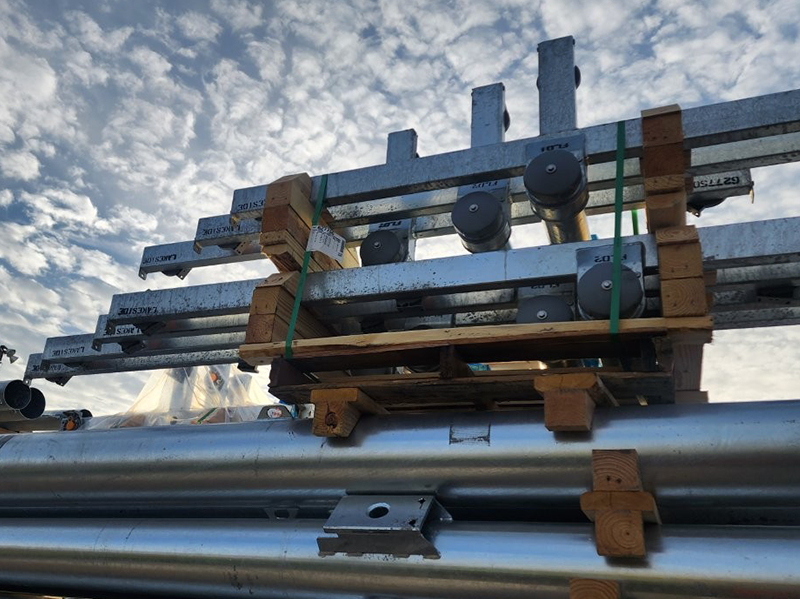 Cactus Park Lighting - light poles stacked in preparation for installation