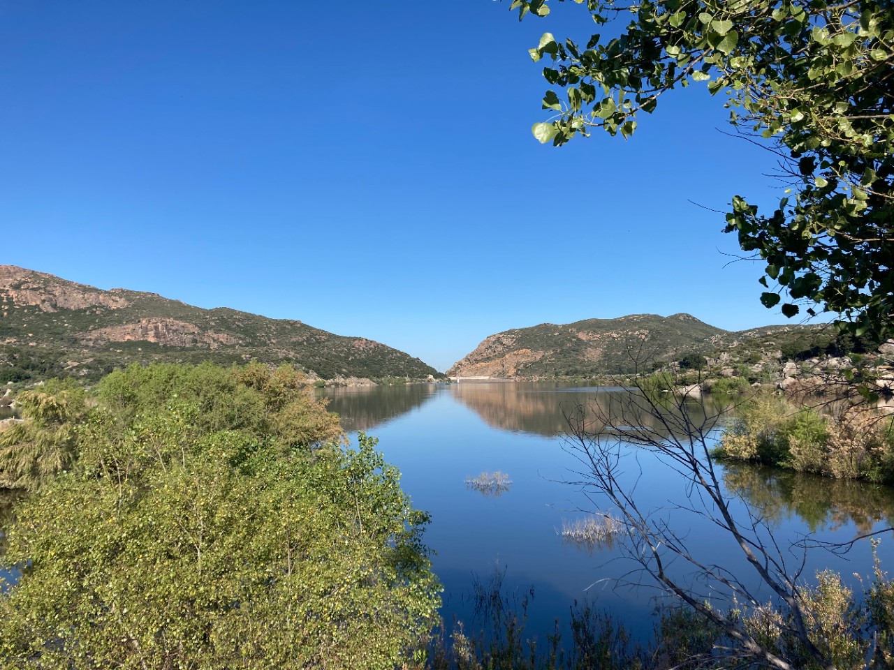 View of the lake surrounded by mountains, desert, and coastal habitats