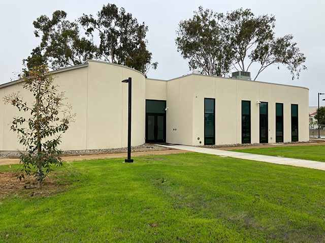 Epicentre showing new building exterior, trees planted, and lawn growing in