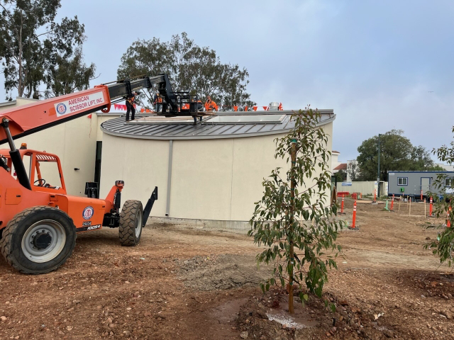 Exterior view of skylights being installed.